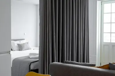 a bathroom with a shower and a toilet and a sink at MyStay Porto - Urban Collection in Porto