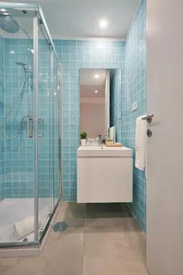 a bathroom with a sink and a shower at Signature Apartments Santa Catarina in Porto