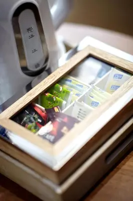 an open drawer of a refrigerator on a table at Signature Apartments Santa Catarina in Porto