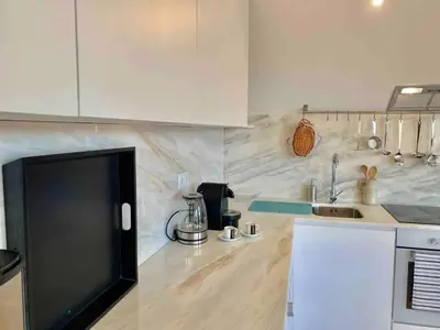 a kitchen with a sink and a counter top at Spacious Apartment in Porto with Terrace in Porto