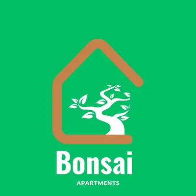 a sign for bonsaiagents with a picture of a tree in a bin at Bonsai Apartment I in Porto