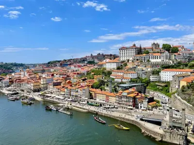 a view of a city with boats in the water at ZD Moreira Flats B By PortoProperties4You in Porto