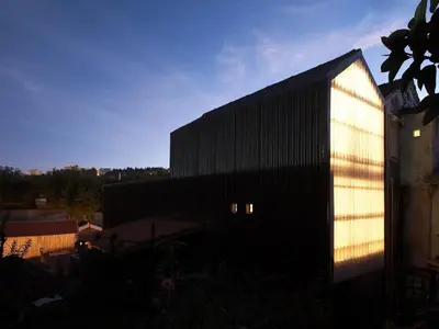 a black building with a light on the side of it at Casa Castanha in Porto
