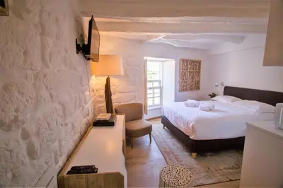 a bedroom with a bed and a table and a chair at Porto & Douro Best Views by PCH in Porto