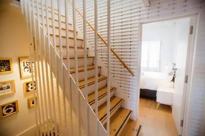 a staircase leading to a bedroom with a bed at Porto & Douro Best Views by PCH in Porto
