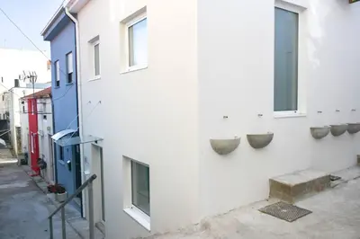 a living room with a table and a couch at Typical Quarter Nest in Porto