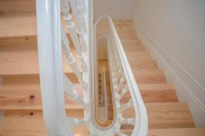 a white stair case in a room at Liiiving in Porto - Cozy & Chic Downtown in Porto