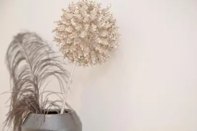 a metal vase with a plant in it at Liiiving in Porto - Cozy & Chic Downtown in Porto