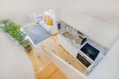 a living room with a couch and a table at Oporto Bonjardim Loft in Porto