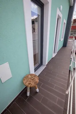 a stool sitting on the side of a building at Porto Insight Apartments Campanhã in Porto