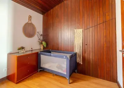 a large fish tank in a room with a wooden wall at Terraço da Boavista in Porto