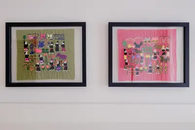 two framed pictures of flowers on a wall at BOUTIQUE Rentals-Flores Plaza in city historical center in Porto