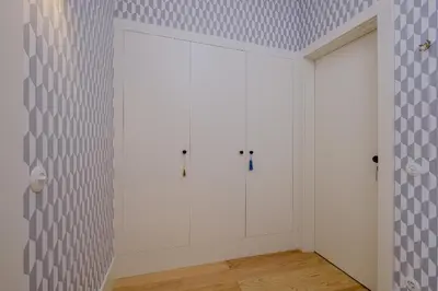 a room with white cabinets and a wall at BOUTIQUE Rentals-Flores Plaza in city historical center in Porto