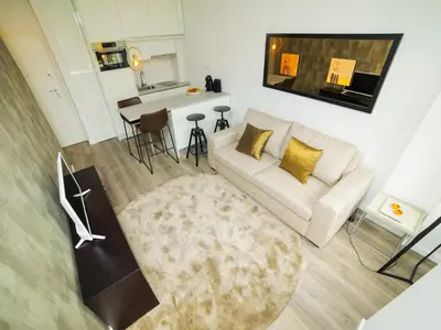 a living room with a couch and a table at Angel Flats in Porto