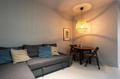 a living room with a couch and a table at Marias River Apartment in Porto