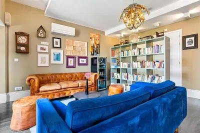a bedroom with a bed and a desk and a window at Jardim da Batalha Boutique Hotel by Shiadu in Porto