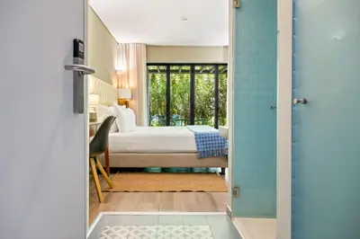 a small table and a chair on a balcony at Jardim da Batalha Boutique Hotel by Shiadu in Porto