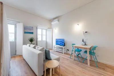 a living room with a couch and a table at GuestReady - Bay Watch in Porto