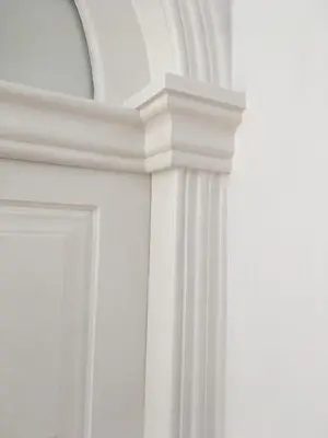 a white room with a pillar and a mirror at Pimms Home Ribeira in Porto