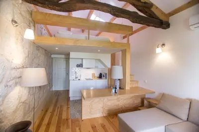 a living room with a couch and a table at Picasso Suites Porto by PCH in Porto