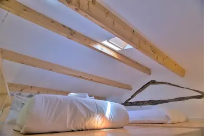 a room with two white bean bags on the floor at Picasso Suites Porto by PCH in Porto