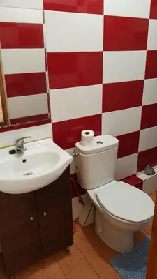 a bathroom with a toilet and a sink at Oporto Beauty Flat in Porto