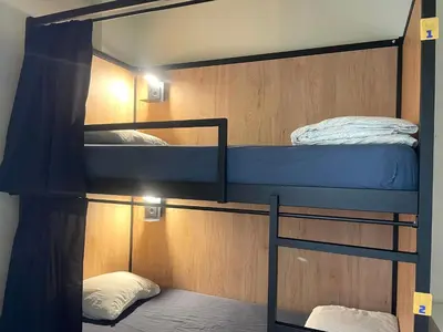 a bunk bed room with two bunk beds in it at Onefam Ribeira in Porto