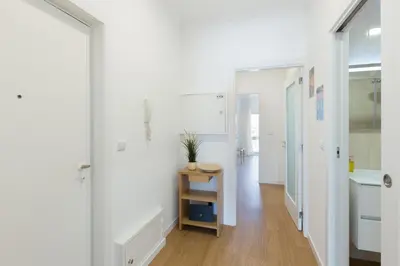 a white hallway with a sink and a table at Host Wise - Annas Flats II in Vila Nova de Gaia