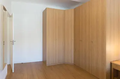 a room with wooden cabinets in a room at Host Wise - Annas Flats II in Vila Nova de Gaia