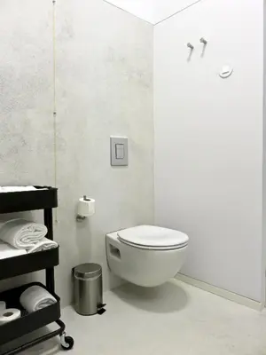 a bathroom with a white toilet in a room at Oporto Serviced Apartments - Miragaia in Porto