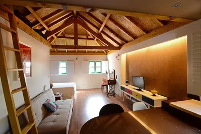 a living room with a couch and a flat screen tv at Vitoria Apartments in Porto