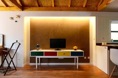 a room with a desk with a television on it at Vitoria Apartments in Porto