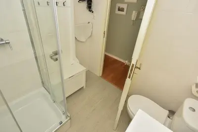 a bathroom with a shower and a toilet at Vitoria Apartments in Porto
