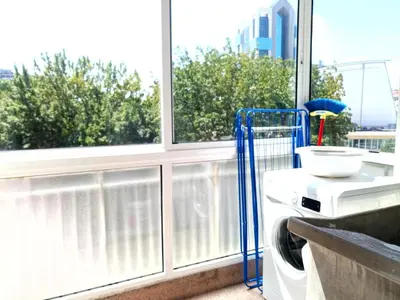 a washing machine sitting in front of a window at DISCOVER PORTO - Boavista in Porto