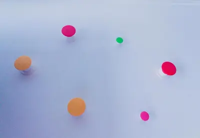 a group of colored balls on a white background at A Ilha do Lindo Vale in Porto