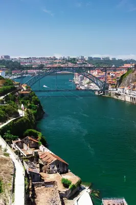a view of a river with a bridge in the background at Porto Insight Cedofeita- Parking, Balconies & AC in Porto