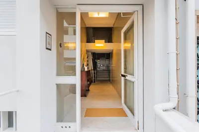 a hallway with a door leading into a room at AMAZING DUPLEX - Mid Century Experience & PARKING in Porto