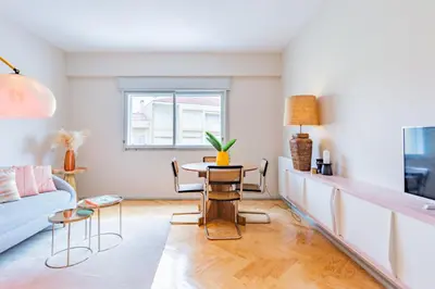 a living room with a table and a couch at INCREDIBLE DUPLEX PENTHOUSE & TERRACES & Parking in Porto