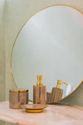 a mirror sitting on top of a bathroom counter at INCREDIBLE DUPLEX PENTHOUSE & TERRACES & Parking in Porto