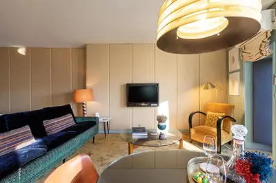 a living room with a blue couch and a table at Urban Apartment Casa da Portela in Porto