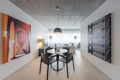 a dining room with a table and chairs at Cedofeita Lux Design in Porto