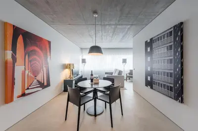 a dining room with a table and chairs at Cedofeita Lux Design in Porto