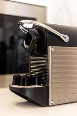 a toaster oven sitting on top of a table at Wood Premium Downtown Apartment by DA'HOME in Porto