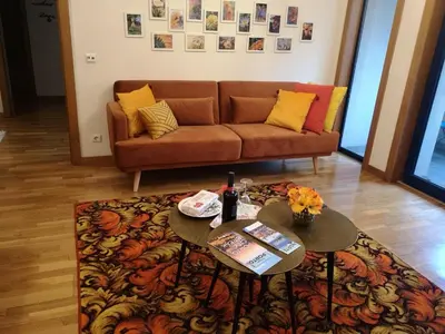 a living room with a couch and two tables at Architect House in Porto