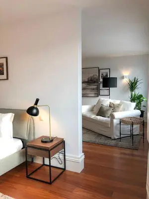 a living room with a white couch and a table at Oporto Chic&Cozy - Aliados in Porto