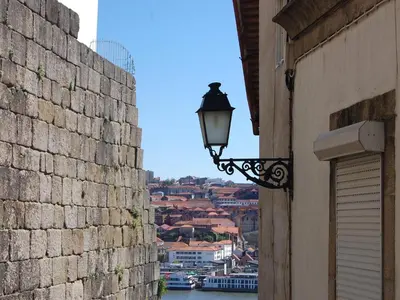a street light on the side of a building with a view at Top Flat in Porto