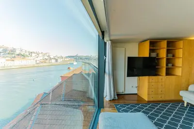 a view of the water from a room with a window at LUXURY VIEWS by YoursPorto in Vila Nova de Gaia