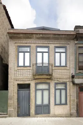 a brick building with four windows and a balcony at Relax Porto Studio by Own Places in Porto