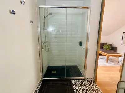 a bedroom with a mirror and a bed in a room at Boreal Porto Gaia - Patio & Pool in Vila Nova de Gaia