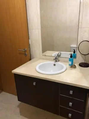 a bathroom with a sink and a mirror at InPorto in Porto